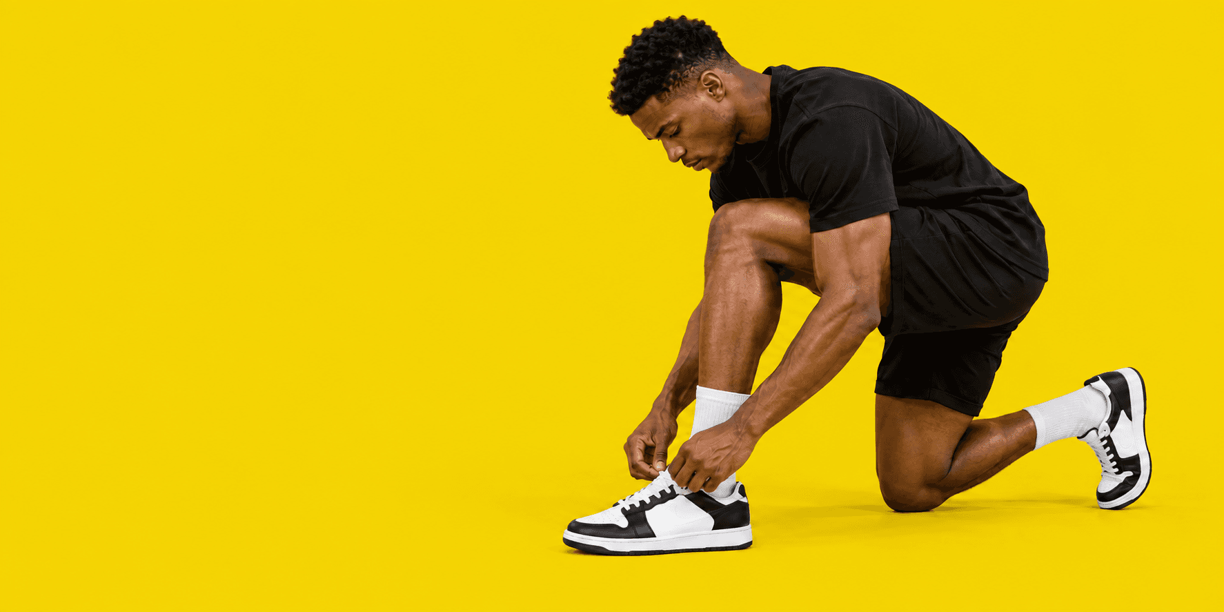 Person tying a sneaker before heading out